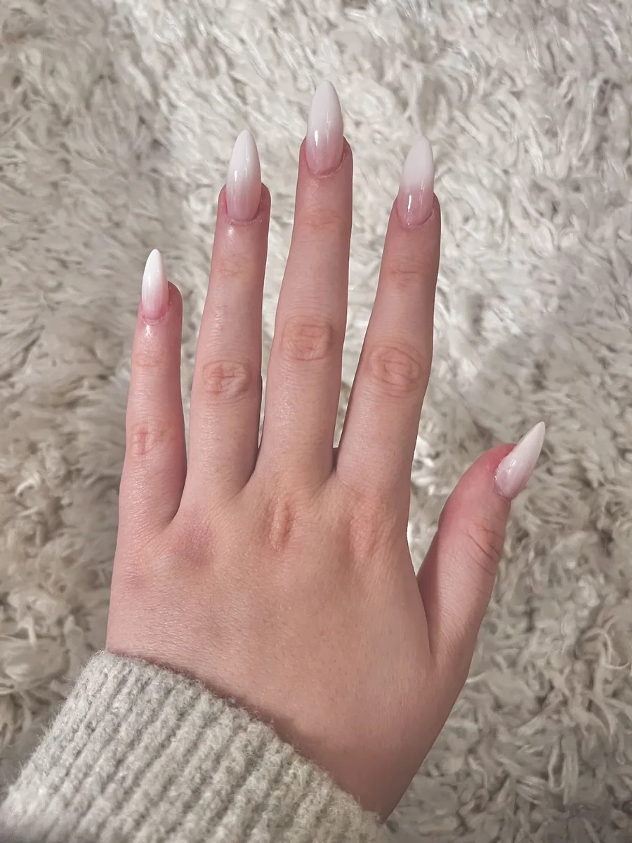 Long stiletto nails in a soft pink-to-white ombre